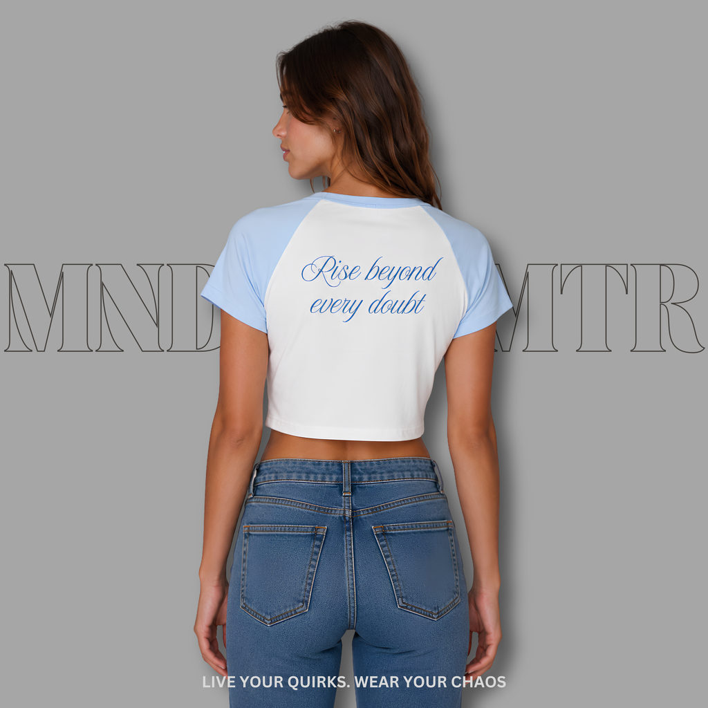 Woman wearing a white and blue baseball shirt with 'mndovrmtr™' branding on a gray background