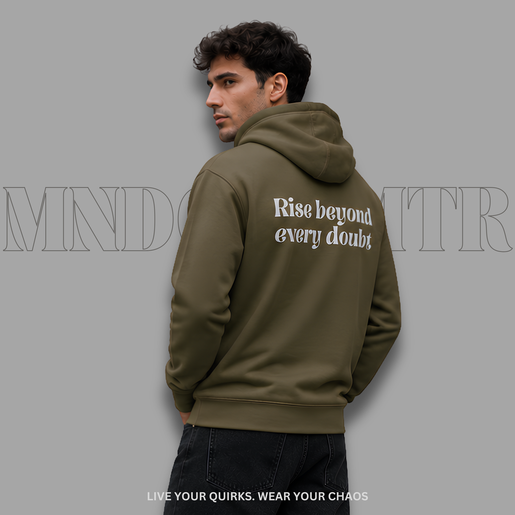 A man wearing an military green, fleece, oversized, hoodie with front pocket, and a grey text on the back reading 'Rise beyond every doubt', shown from the back against a solid gray background.