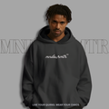 MNDOVRMTR oversized, fleece, hoodie, worn by a male model with 'mndovrmtr' branding on a gray background