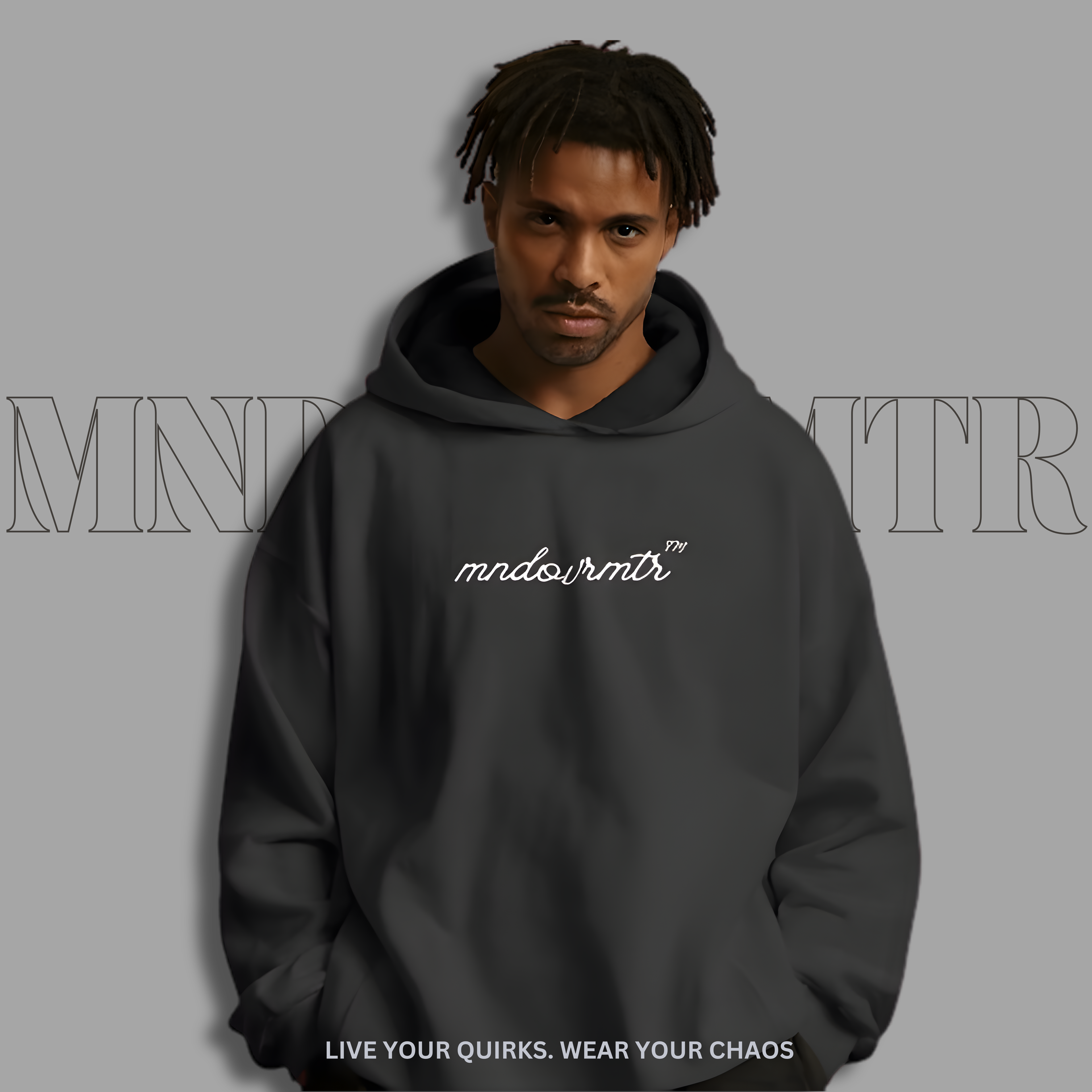 MNDOVRMTR oversized, fleece, hoodie, worn by a male model with 'mndovrmtr' branding on a gray background