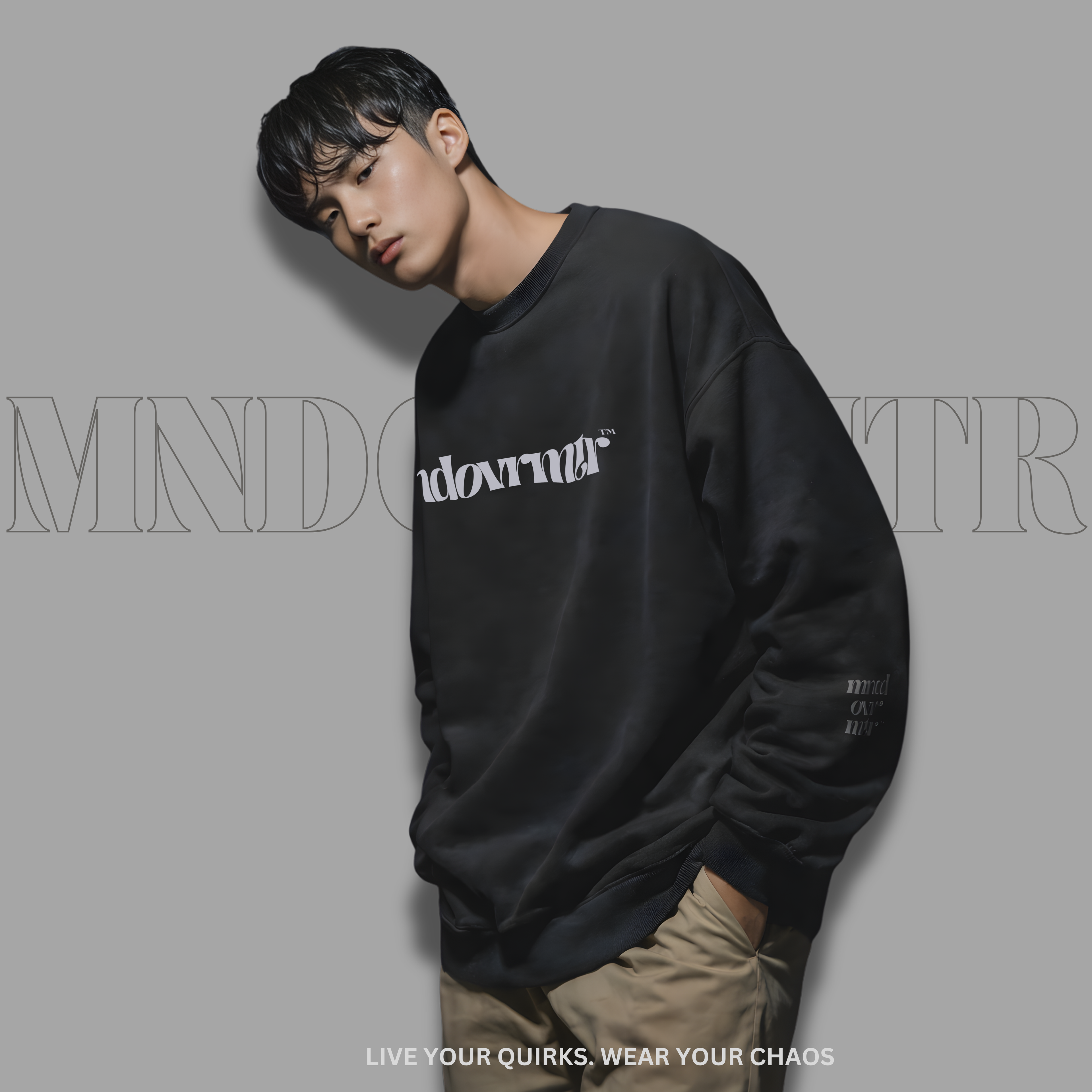 MNDOVRMTR™ premium streetwear sweatshirt in black - chest logo close-up detail