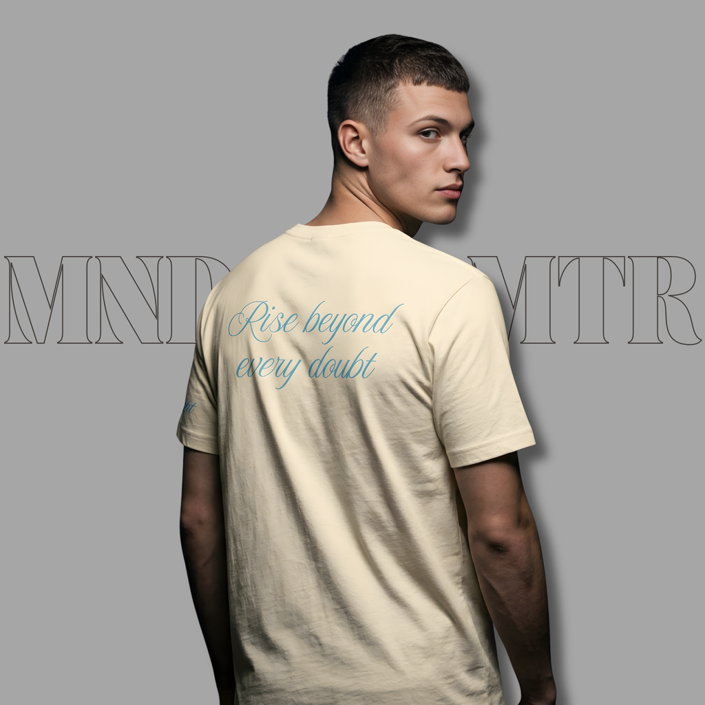 MNDOVRMTR Vintage White-Script Shirt – Minimalist Mind Over Matter Streetwear Tee  - worn by a stunning male model. The soft cursive back design is highlighted as the man stands against a gray background